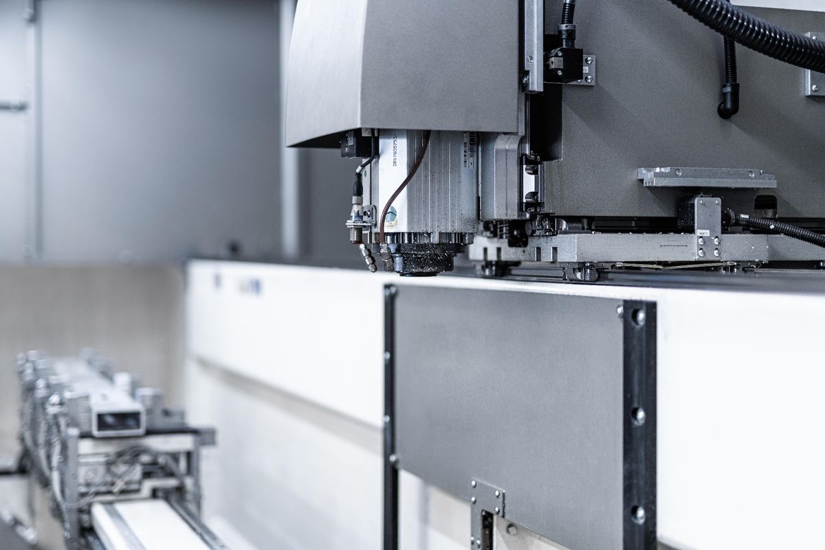 CNC machining centre with precision metal components on the production line in a factory