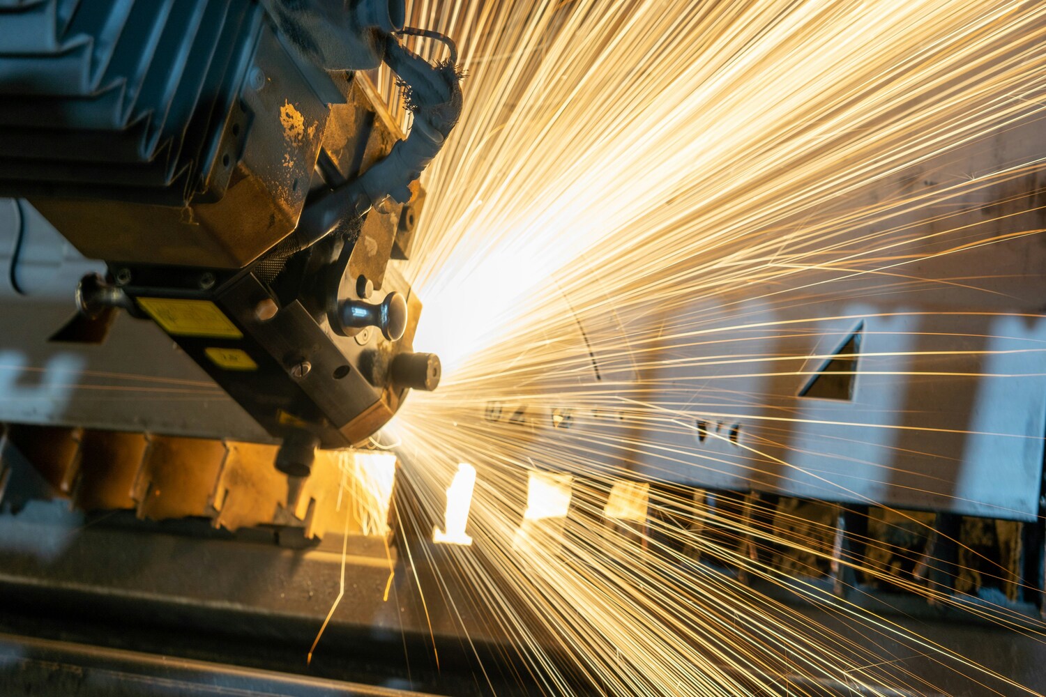Worker inspecting equipment on a factory production floor